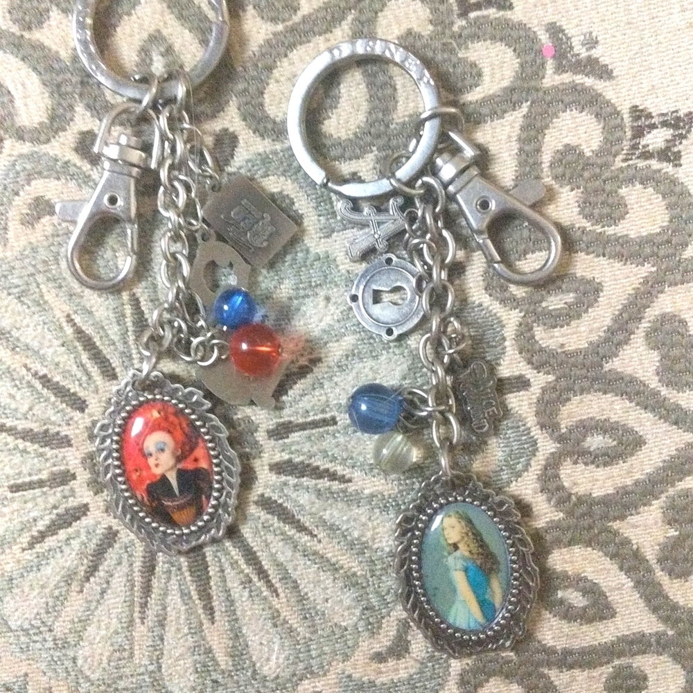 ALICE IN WONDERLAND.TWO KEY CHAINS..DISNEY BRAND